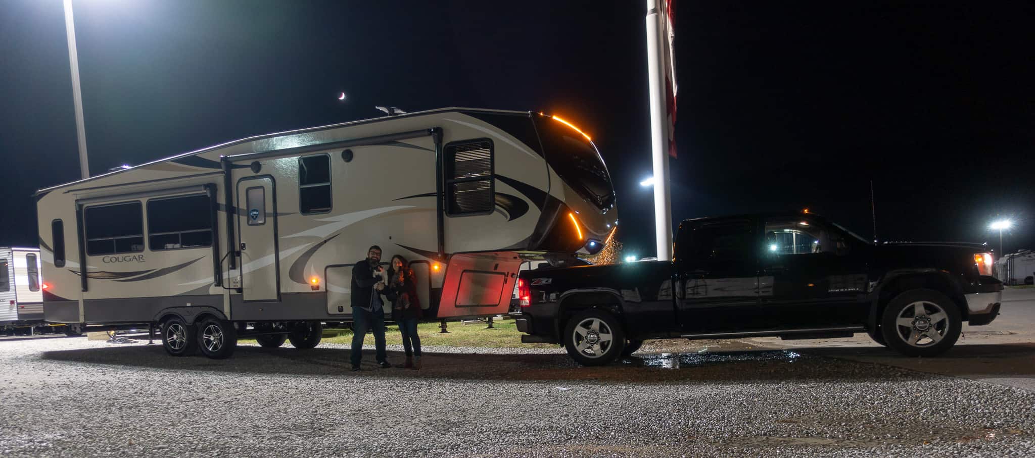 Us posing with our RV the night before taking off