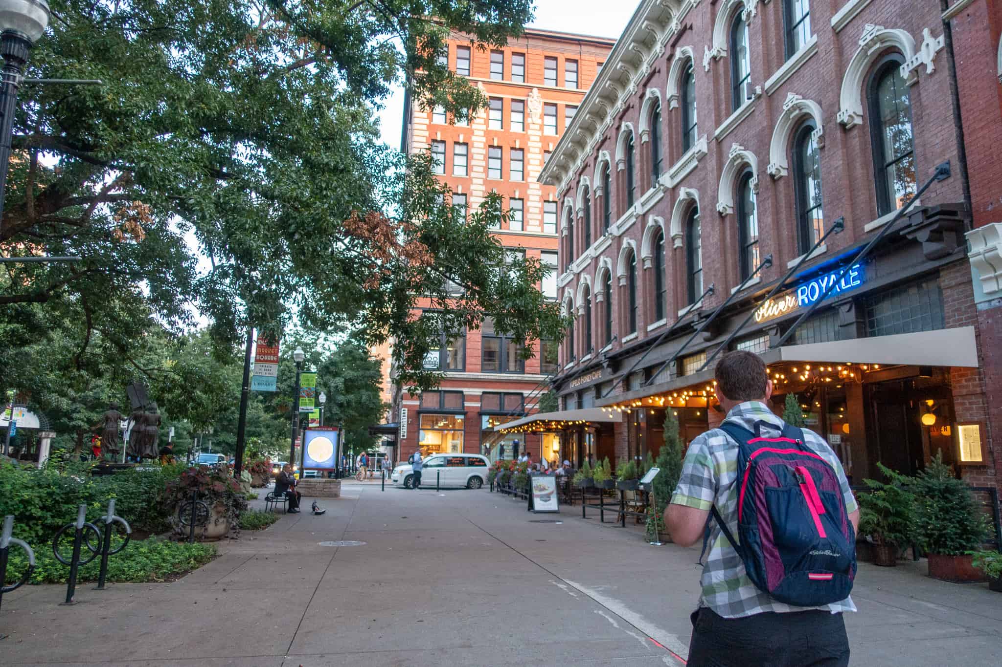 Barrett walking by the Oliver hotel in Knoxville, Tennessee, one of the best places to stay in downtown Knoxville.