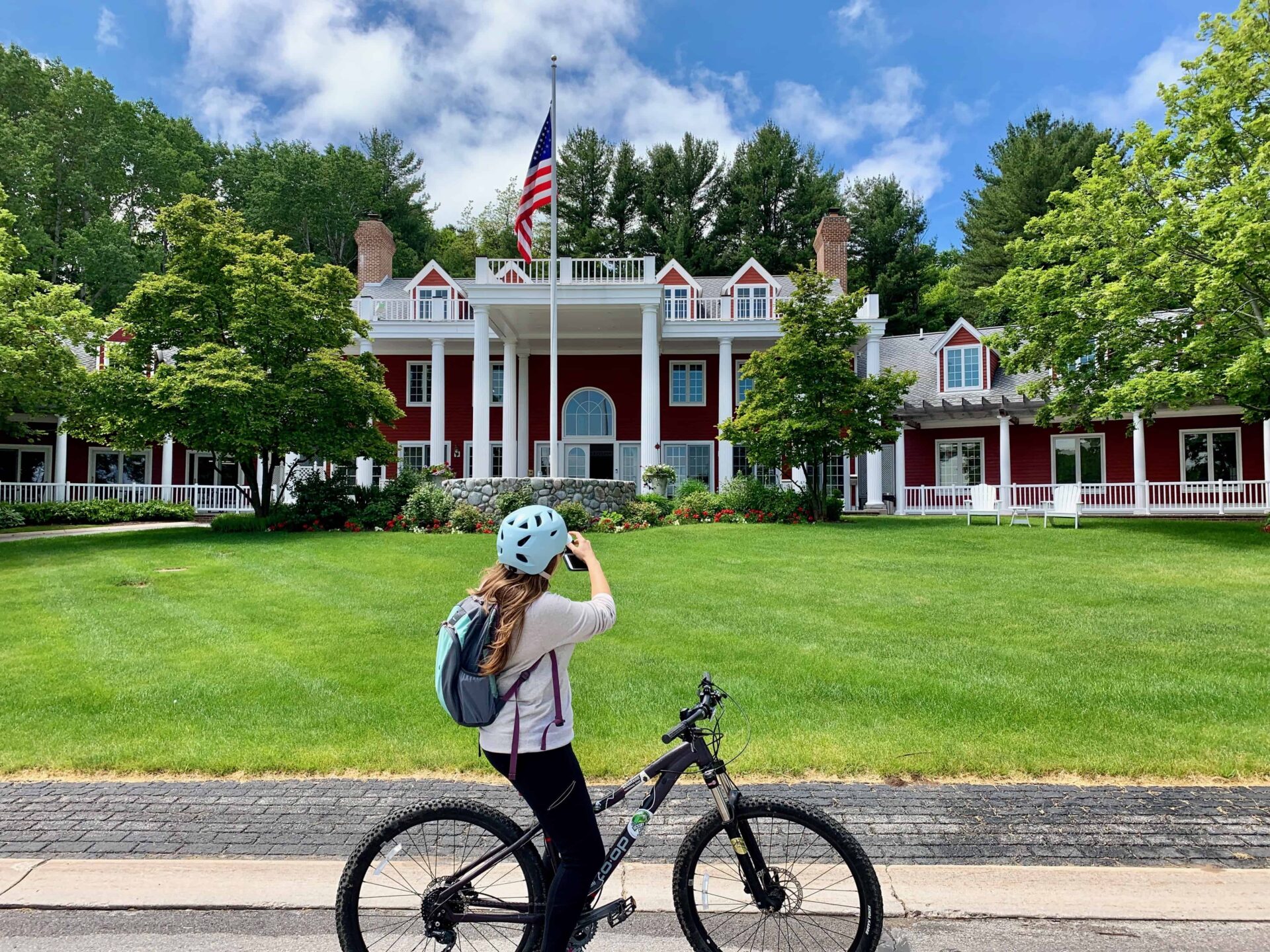 Cindy taking a picture while on her bike of the Inn at Black Star Farms in Suttons Bay, Michigan