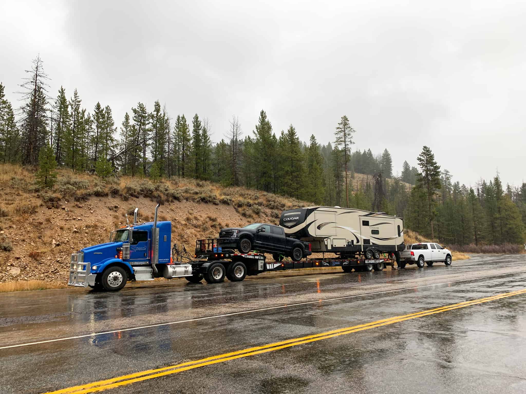 Our RV and truck, being towed on a flatbed