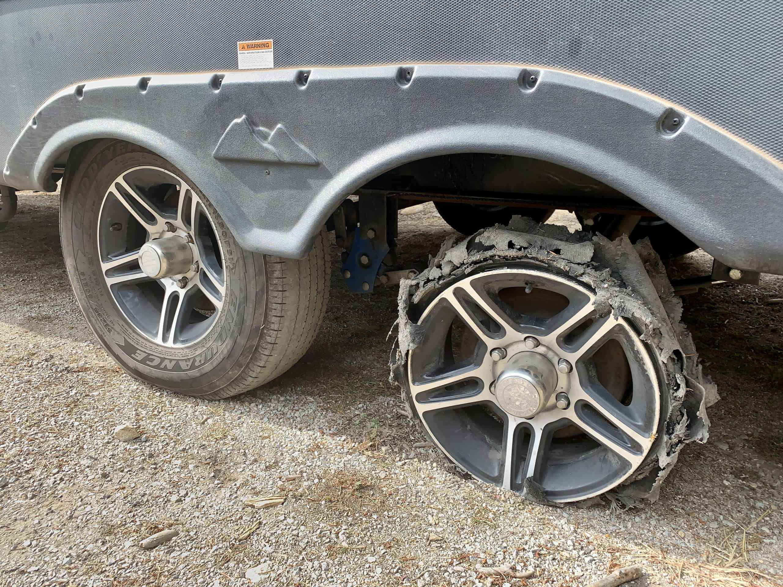 A shredded tire on our RV during full-time RV living