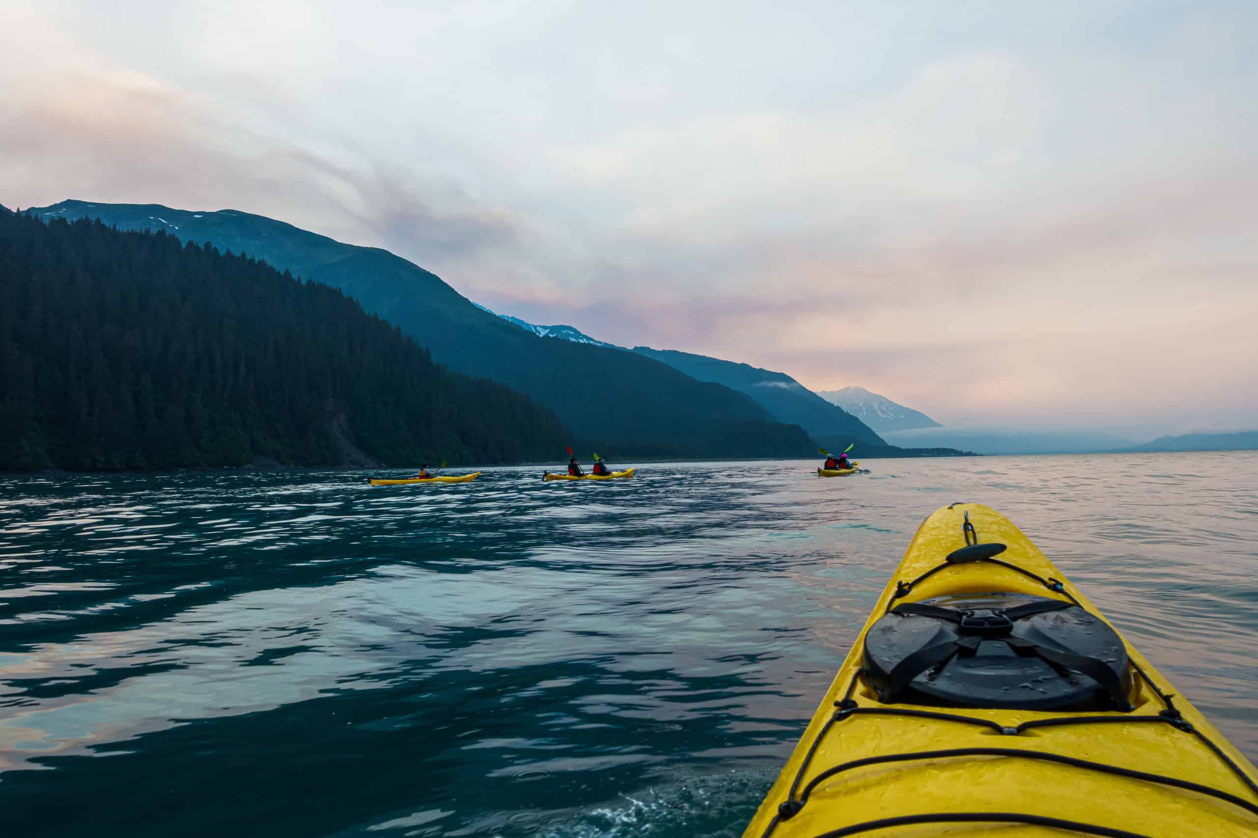 Cindy Sea Kayaking at Midnight, in June, in Seward, Alaska