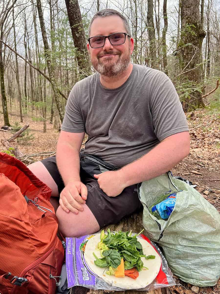 Barrett making a wrap on trail while hiking