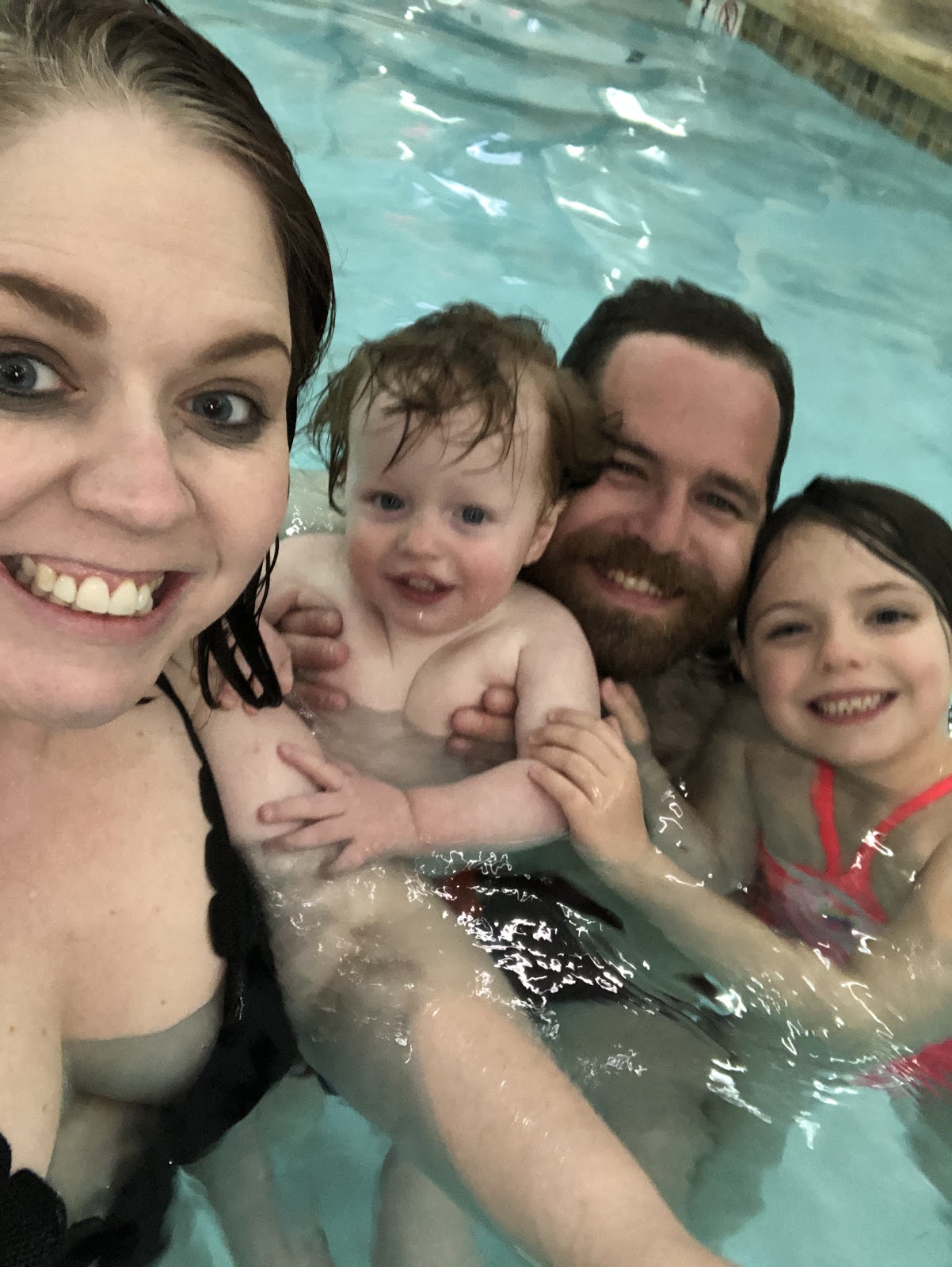 Family on vacation in pool